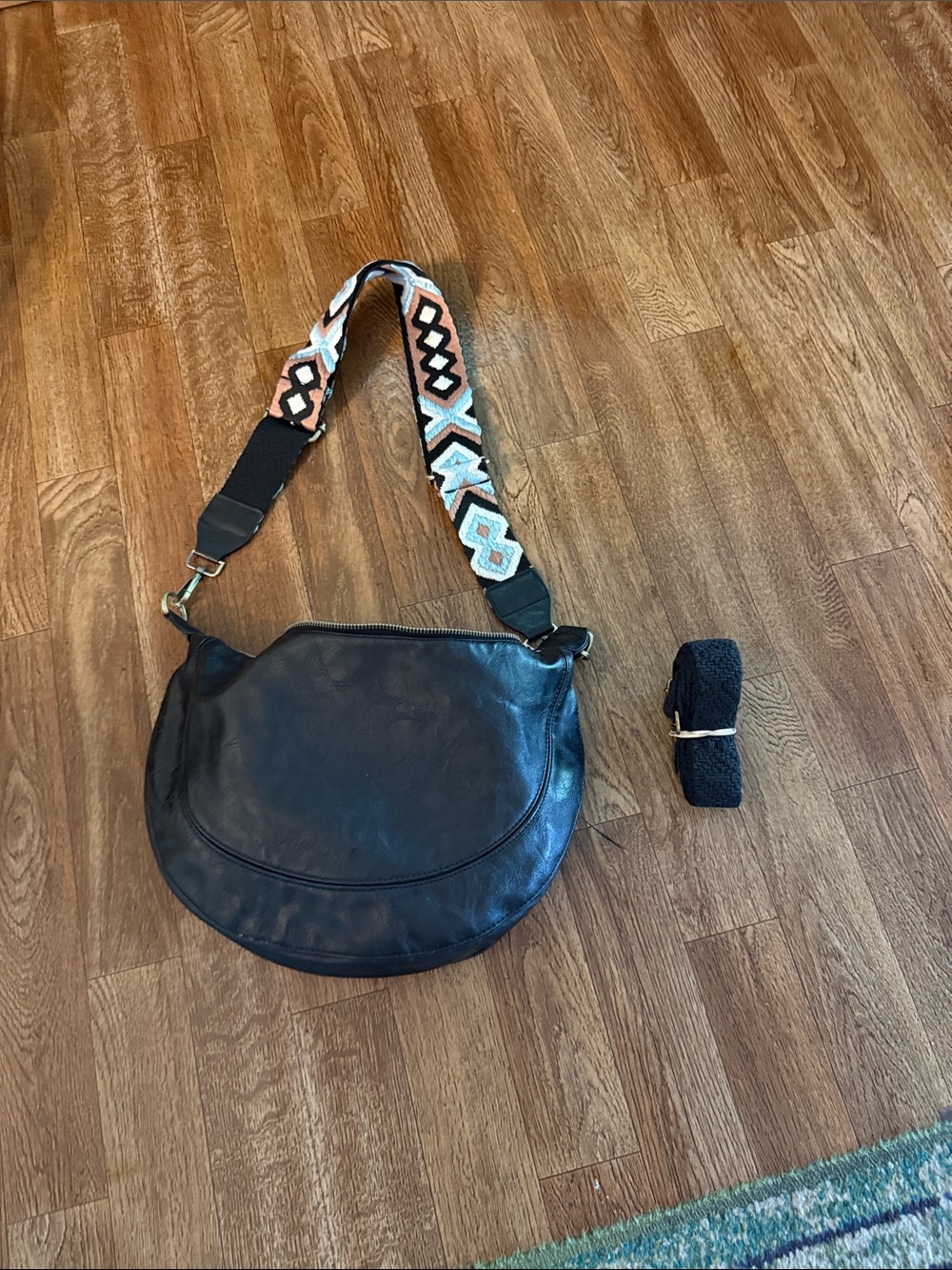 Black faux  Leather Crescent Crossbody with Patterned Strap. Two straps.